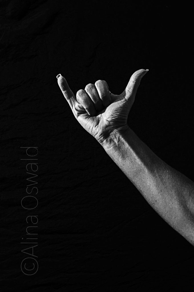 Hang Loose (like a mongoose). Hawaii handshake. Hand self-portraits in black and white. ©Alina Oswald.